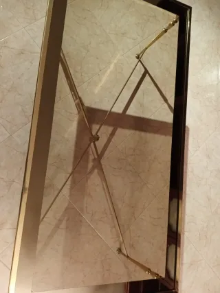 Mesa de centro cristal y metal dorado