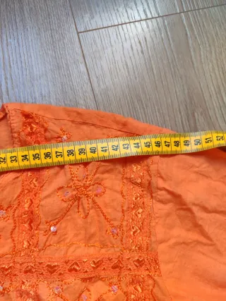 Camisa naranja manga larga con lentejuelas
