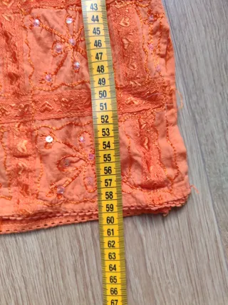 Camisa naranja manga larga con lentejuelas