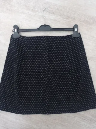 Falda negra cremallera frontal