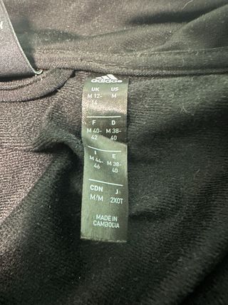 Chaqueta Adidas negra con rayas blancas