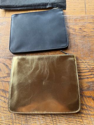 2 neceseres YSL Beauté negro y dorado