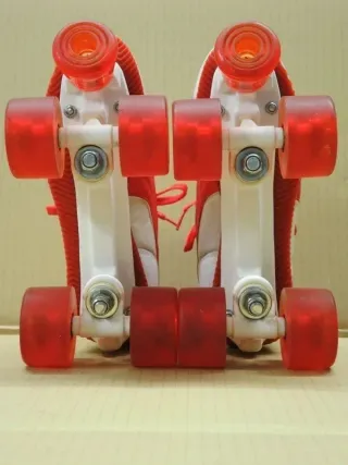 Pattini a rotelle Puma bianchi/rossi