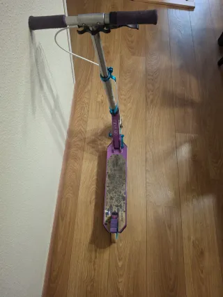 Patinete plegable Oxelo morado y sus....