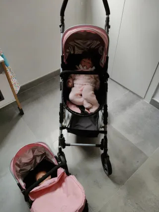 Carrito gemelar para muñecas rosa