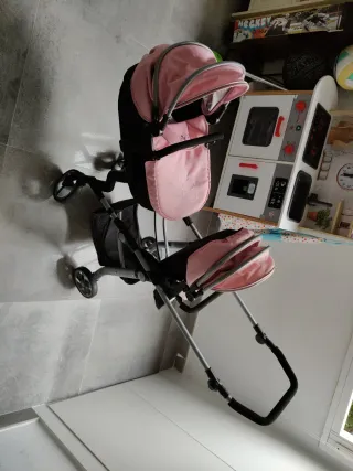 Carrito gemelar para muñecas rosa