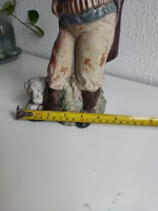Figura porcelana cazador con perro
