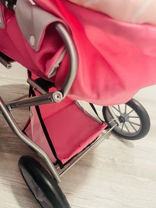 Carrito de juguete para muñecas rosa