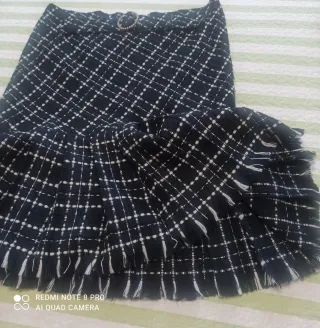 Falda cuadros plisada con flecos