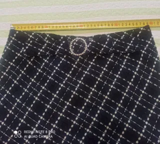 Falda cuadros plisada con flecos