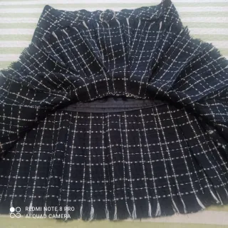 Falda cuadros plisada con flecos