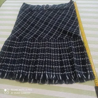 Falda cuadros plisada con flecos