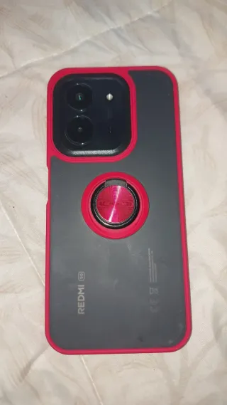 Redmi 15cnegros con funda roja