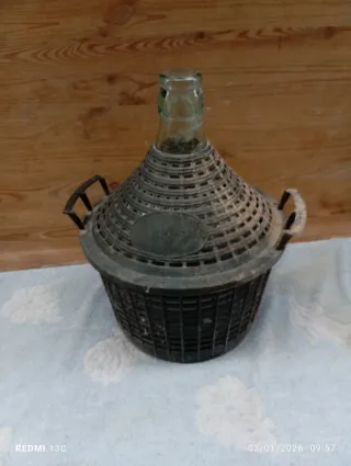 Damigiana in vetro vintage con cestello