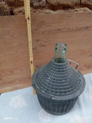 Damigiana in vetro vintage con cestello