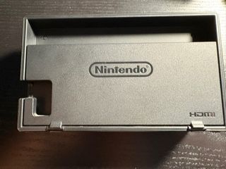 Nintendo Switch Gris + Dock TV + 2 juegos + funda