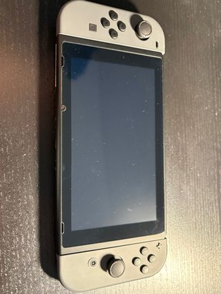 Nintendo Switch Gris + Dock TV + 2 juegos + funda