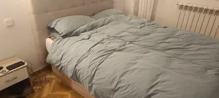 Cama canapé con cabecero tapizado