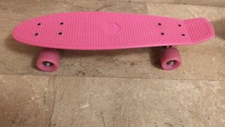 Patinete rosa poco usado