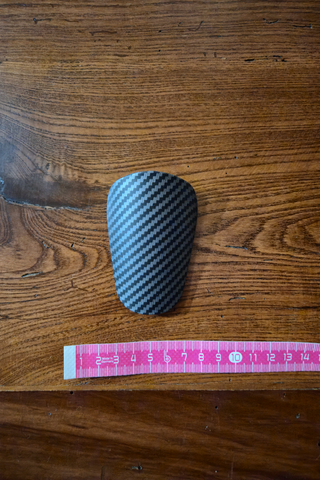 Mini parastinchi calcio carbonio