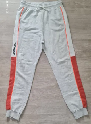 Calças de treino rapaz com risca laranja