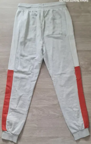 Calças de treino rapaz com risca laranja