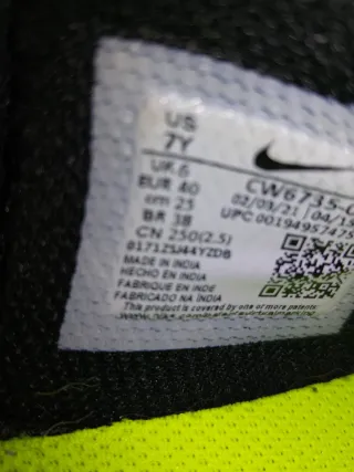 Scarpe Nike Hustle nere e argento