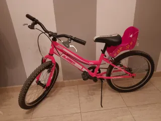 Bicicleta infantil rosa con asiento