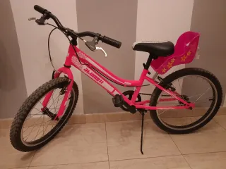 Bicicleta infantil rosa con asiento