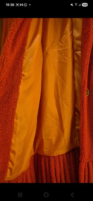 Cappotto arancione lungo con frange