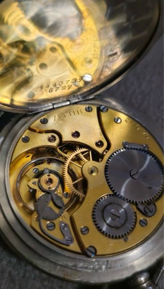 Reloj de bolsillo Zenith antiguo con cadena