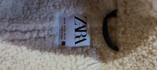 Abrigo borrego Zara gris y blanco