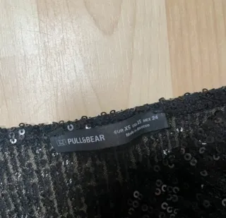 Pantalon y top lentejuelas Pull and Bear negro