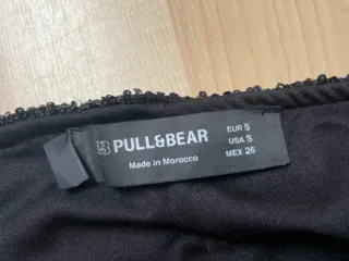 Pantalon y top lentejuelas Pull and Bear negro