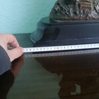 Escultura de bronce de cupido