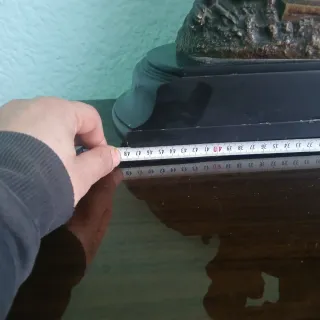 Escultura de bronce de cupido