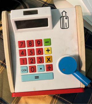 Caja registradora y lote de libros infantiles