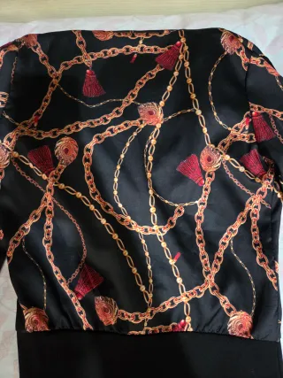 Body elegante nero con motivo catene