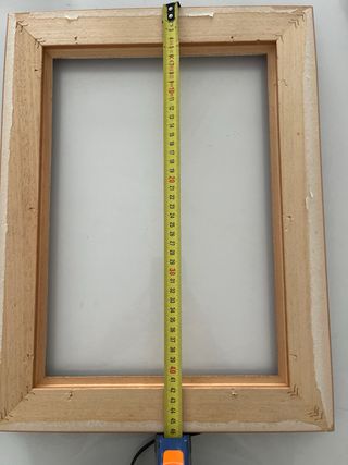 Marco de madera y metal dorado