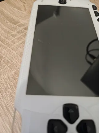 Sony PSP 1004 con caricatore e giochi