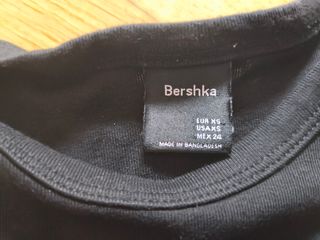 Camiseta Bershka negra con oso y alas - Talla XS