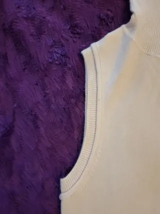 Top sin mangas de punto con cuello alto