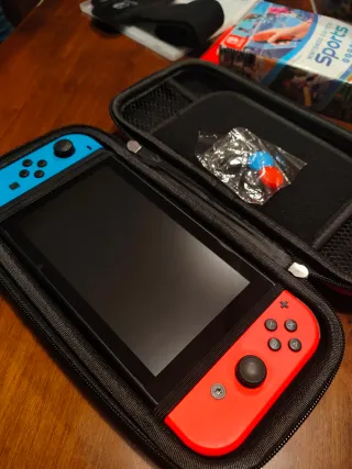 Nintendo Switch + giochi + accessori-case-sd128gb