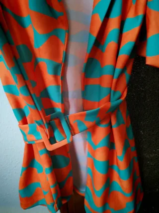 Blazer elegante naranja y turquesa