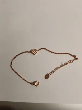 Bracciale color oro rosa e anelli argento