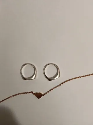 Bracciale color oro rosa e anelli argento