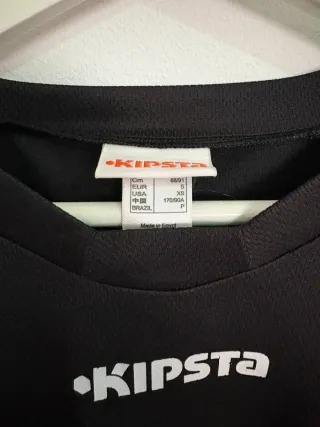 Camiseta sin mangas Kipsta negra y roja