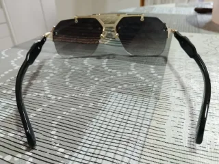 Gafas de sol vintage doradas y negras