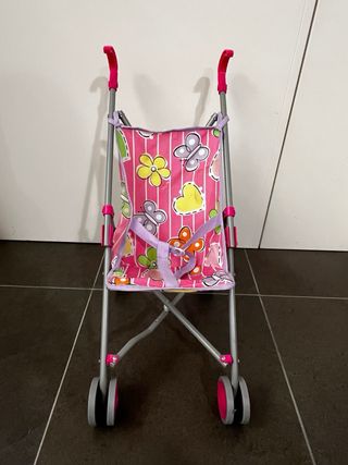 Passeggino giocattolo rosa con farfalle