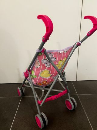 Passeggino giocattolo rosa con farfalle